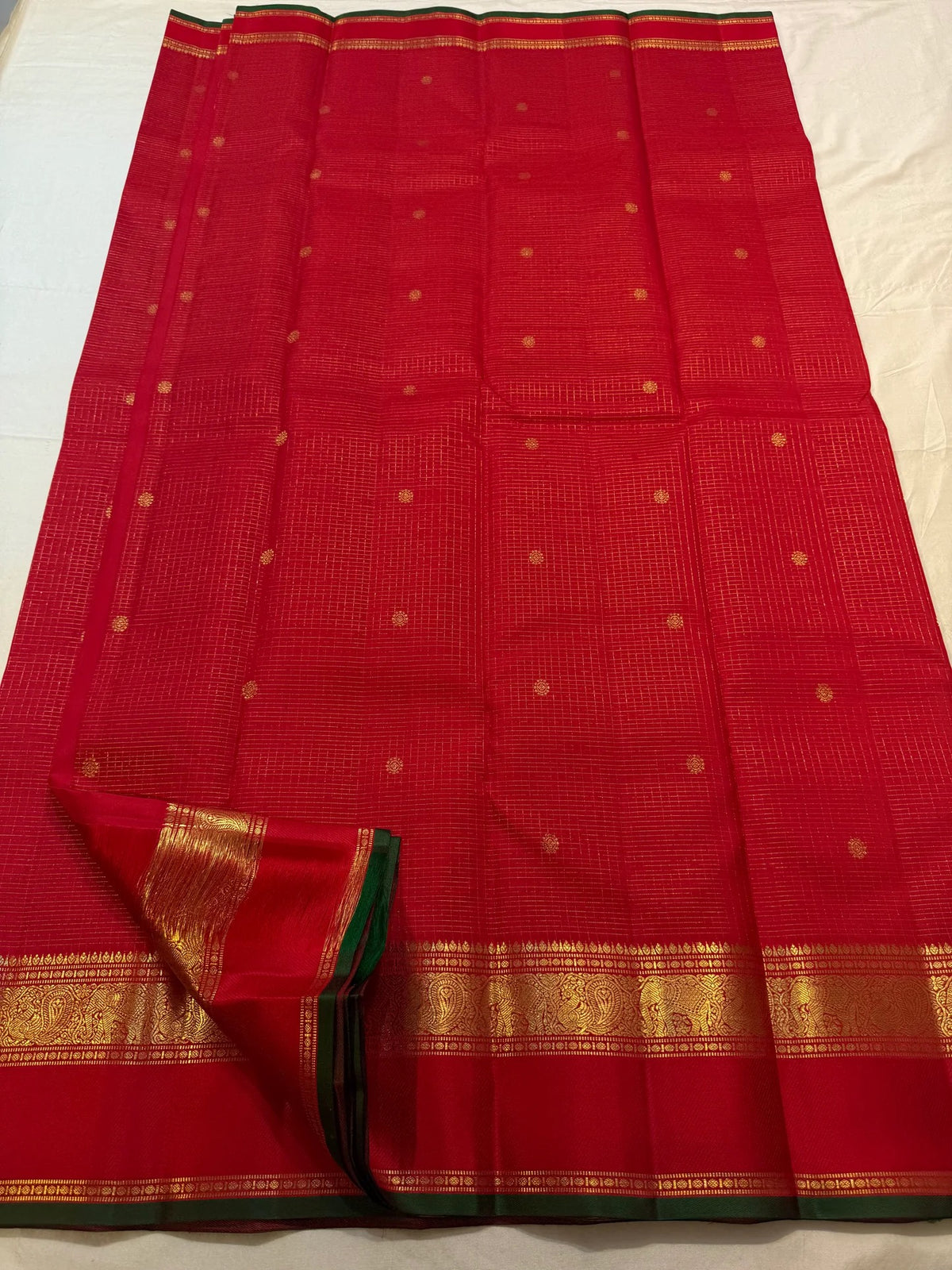 Extremely fine gold grid across saturated Red silk.