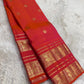 Kanjivaram silk saree in vermilion red with gold border Mayil Butta weave draped view