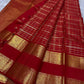 Open Crimson Red Pure Silk Kanchipuram saree with gold Zari Kattam checks and a richly woven Sorgavasal Mayil and Manga border.
