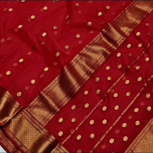 red chanderi saree border area laid open with fine gold-toned detailing