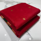 Draped view of a crimson red and forest green handloom Katan Silk Chanderi saree