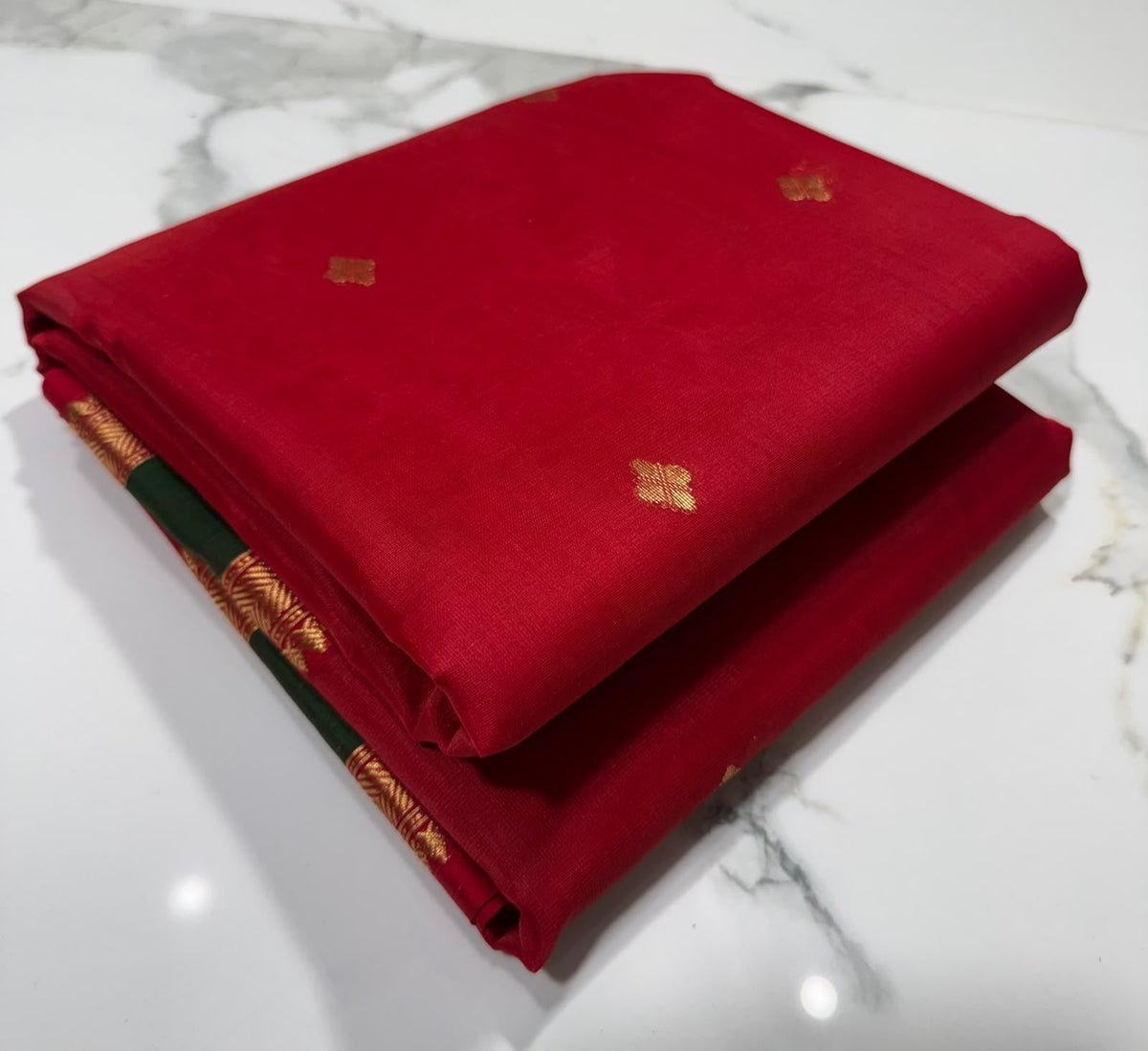 Draped view of a crimson red and forest green handloom Katan Silk Chanderi saree
