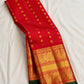 Red handwoven Pure Silk Kanchipuram saree with green-thread Meenakari Kamalam buttas, gold zari border and green selvedge, pallu detail