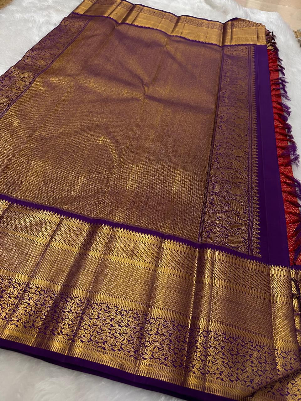 Gold-rich Deep Purple Kanchipuram pallu.