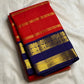 Red Kanchipuram silk saree with royal blue rettapet border folded view