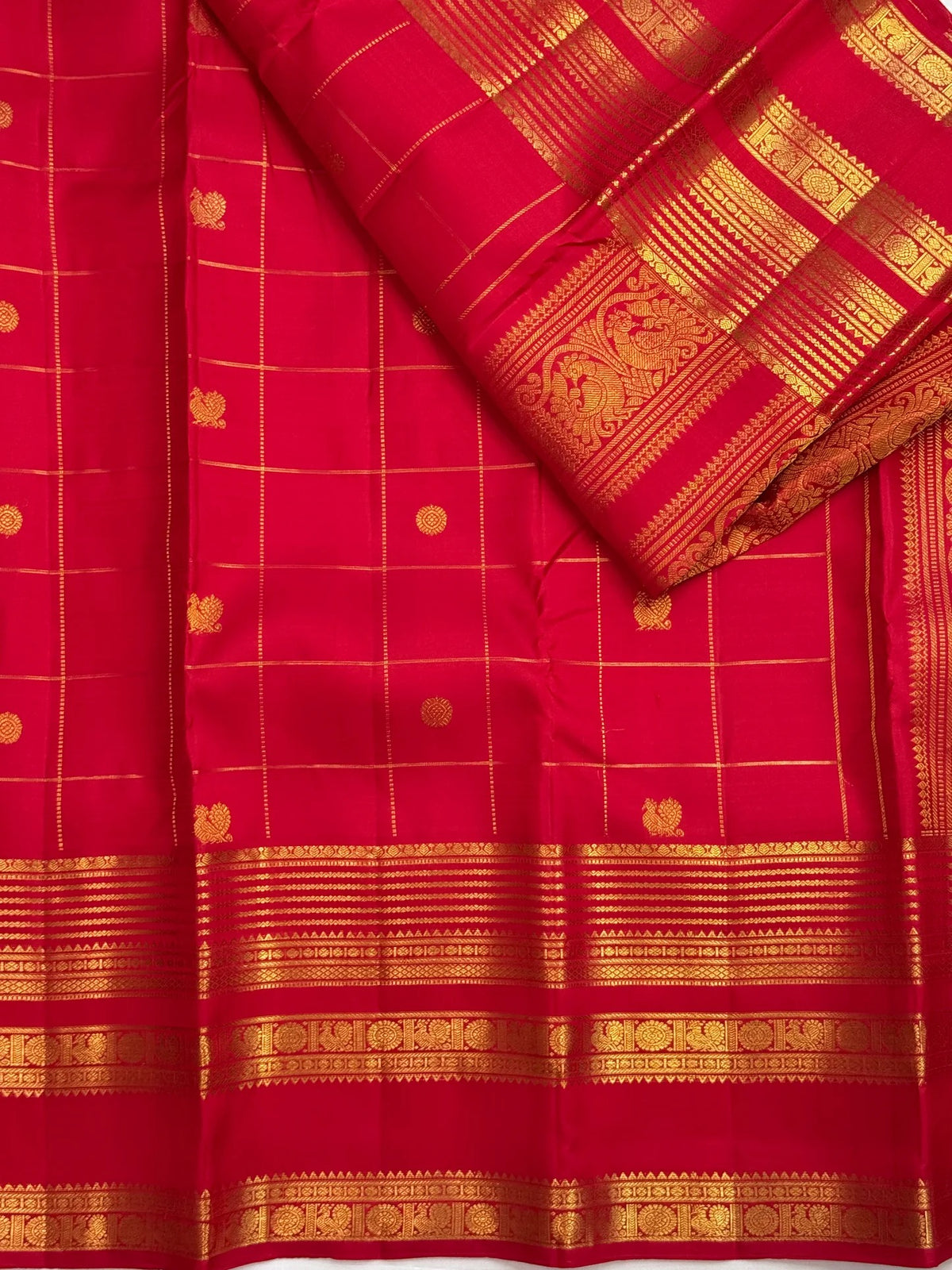 Red Kanchipuram saree with Mayil Chakram buttas, detail view