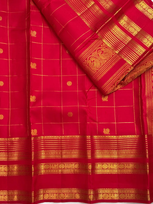 Red Kanchipuram saree with Mayil Chakram buttas, detail view