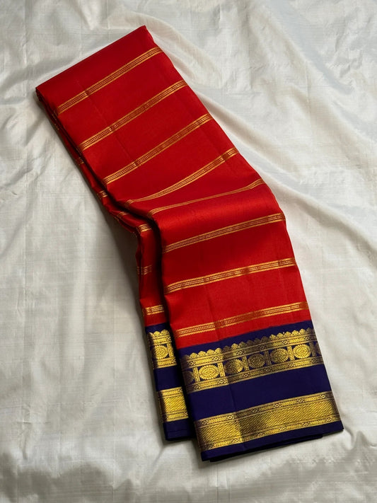 Red Kancheepuram saree with royal blue contrast border detail