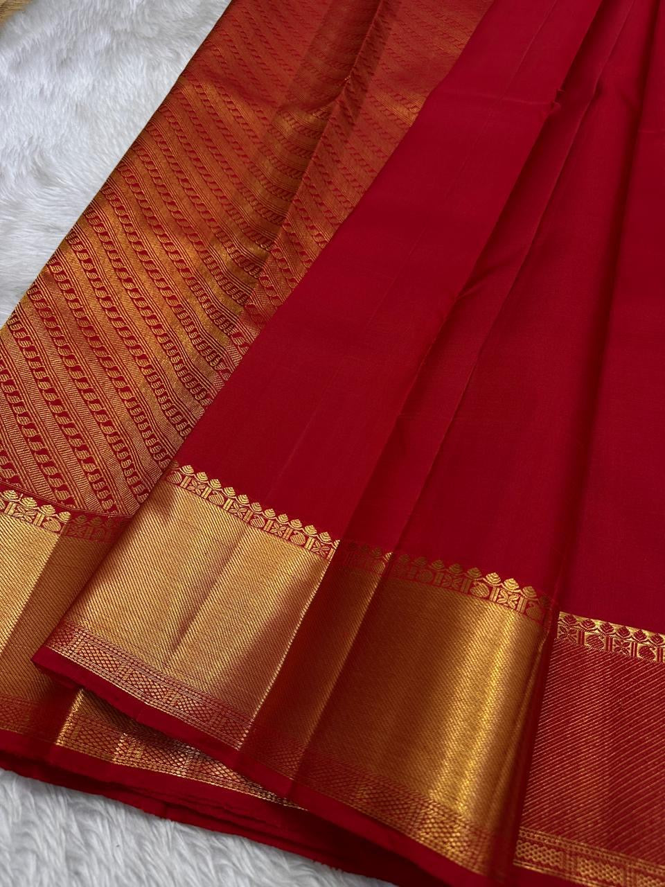 Red Pure Silk Kanjivaram saree showcasing handwoven zari border and elegant silk texture