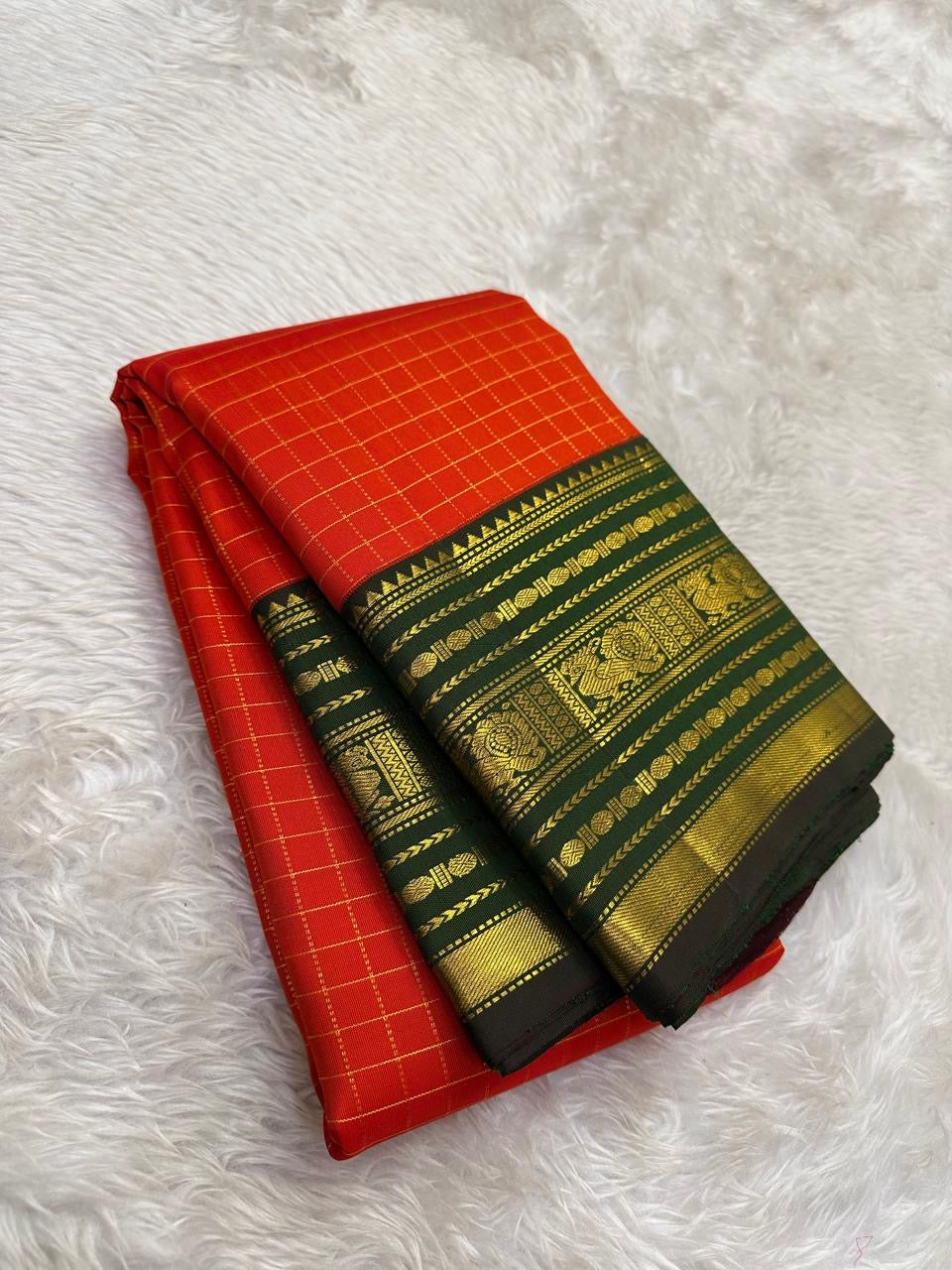 Authentic Kancheepuram silk saree with kungumam red body and contrasting forest green border weaving