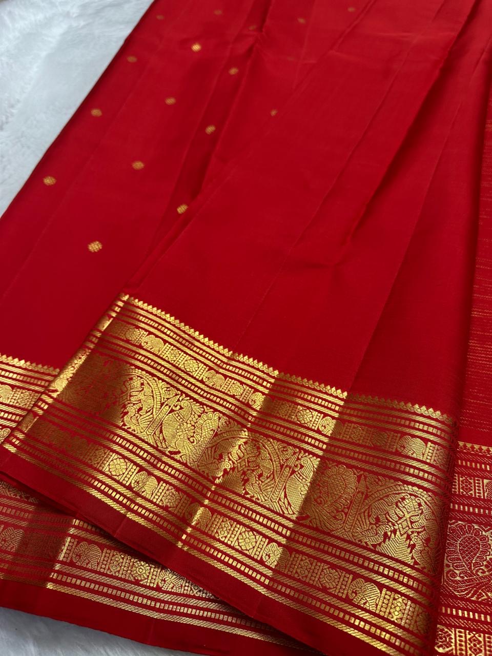 traditional tested zari detail on deep red Kanchipuram silk saree