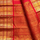 Red handwoven Pure Silk Kanchipuram saree with green-thread Meenakari Kamalam buttas, gold zari border and green selvedge, full saree view