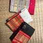 Crimson Kanchipuram Varisaipet saree, silver-grey border with gold zari motifs detail