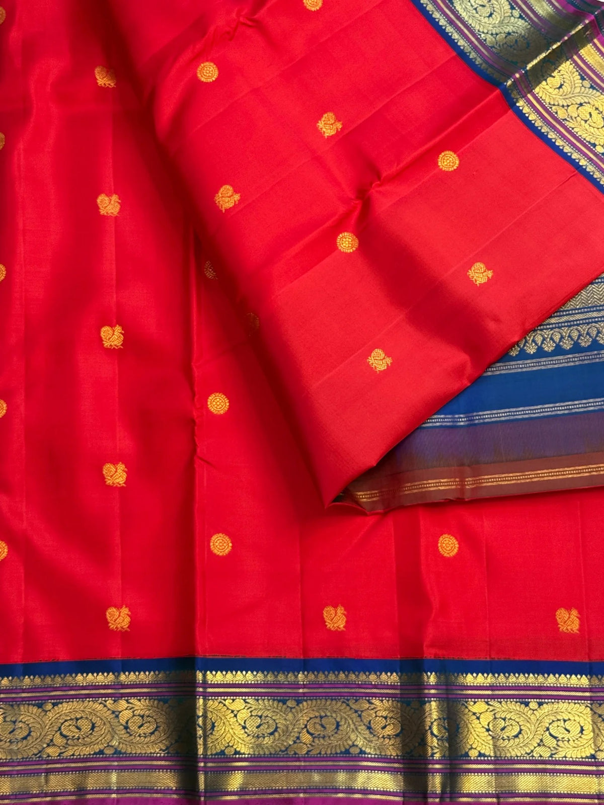 Mayil Chakram zari buttas on Kumkum-red pure silk body