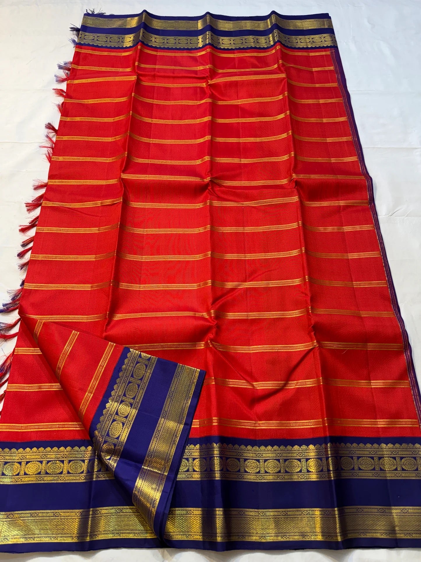 Pure Kanjivaram silk saree in red with traditional zari blue border
