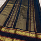 Pillar box red Kanchi Pattu saree, Veldhari gold zari stripe detail