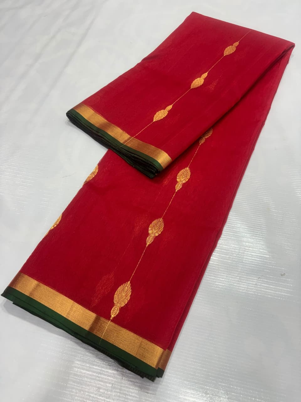 Body detail of crimson-red Katan Silk Chanderi with gold-toned weave