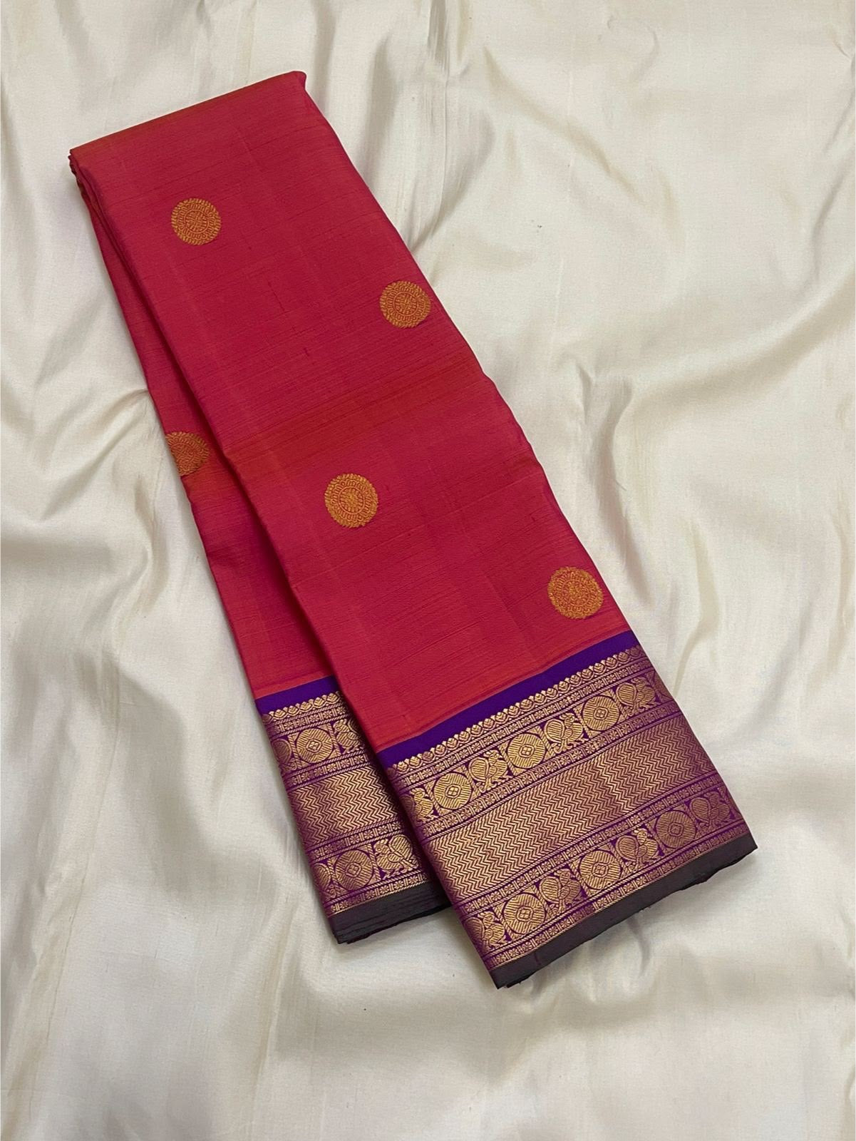 Gold zari coin medallion detail on coral-red shot colour body