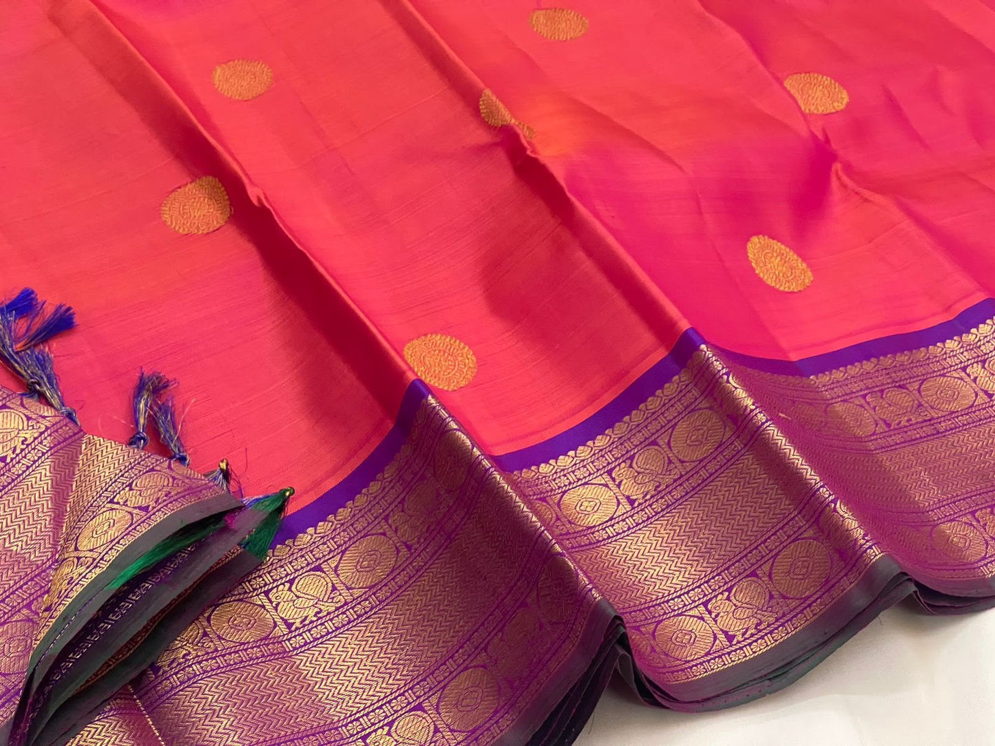 Full coral-red Kanjeevaram Korvai saree folded view