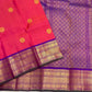 Amethyst purple gold zari pallu detail on coral-red saree