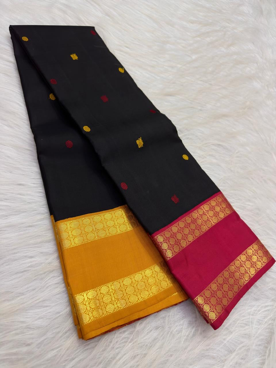 Red and ochre Mayil Chakram motifs on a black Pure Silk Kanjeevaram saree - Idam Living