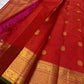Red checked Kanchipuram silk saree with gold butta motifs and zari woven border, pallu visible in pink