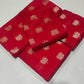 Folded red Pattu Silk Chanderi saree showing repeating gold-toned floral buttas.