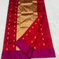 Small gold-toned buttas on crimson silk