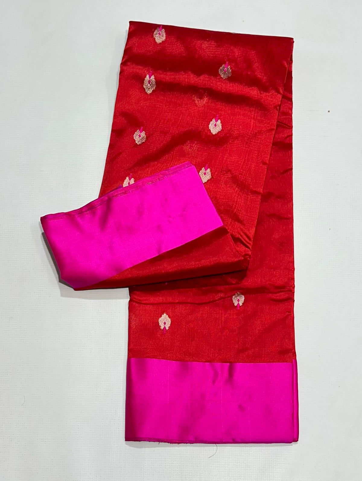 Red silk Chanderi saree with gold-toned details and bright pink border