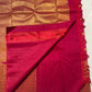 Close view of Red Deep Pink double-shade Kanchipuram silk with dense geometric gold zari pallu and figured border.