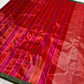 Vermilion Red and Rani Pink handloom Chanderi saree with multicolour woven buttas and narrow deep-green edge