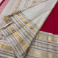 Crimson pure silk Kanchipuram Varisaipet weave, body close-up showing gold zari buttas