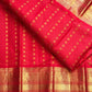Red handwoven Pure Silk Kanchipuram saree with green-thread Meenakari Kamalam buttas, gold zari border and green selvedge, body weave detail