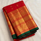 Red handwoven Pure Silk Kanchipuram saree with green-thread Meenakari Kamalam buttas, gold zari border and green selvedge, folded silk detail