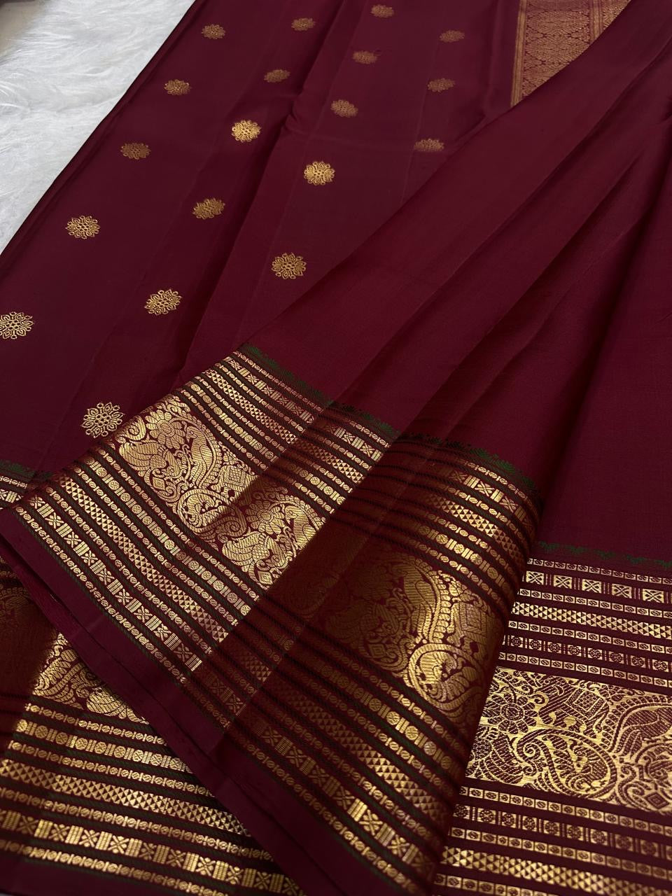 Red Pure Silk Kanchipuram Varisaipet saree with gold zari buttas.
