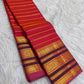 Vermilion red Pure Silk Kanchipuram Varisaipet saree with twisted zari bands.