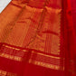 Tonal red Rettapet border with multiple parallel classic-gold zari registers and floral rosette detailing.
