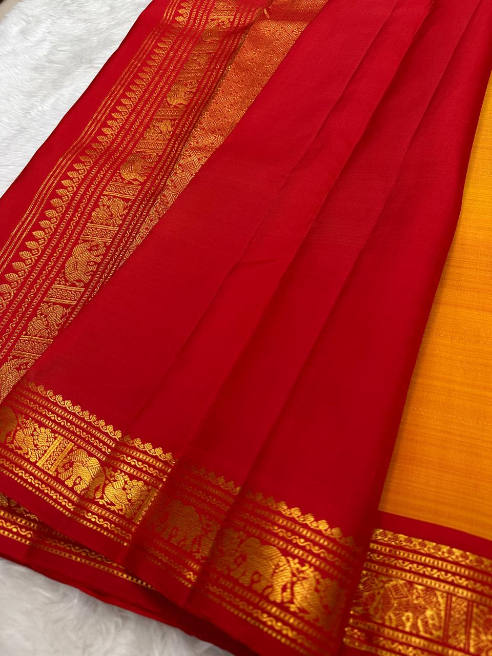 Red pallu section of pure silk Kanchipuram saree with antique gold zari border detailing