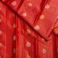 Red and gold pallu displaying repeated paisley shapes within a densely woven zari lattice grid