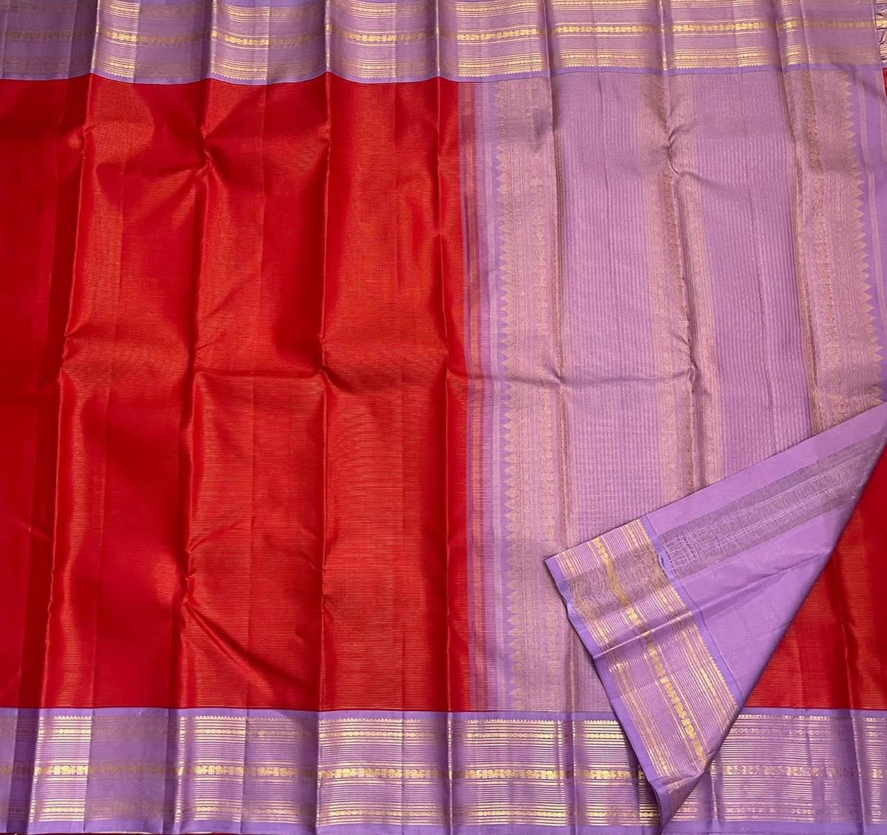 Lavender-purple gold zari border on red Vairaoosi saree