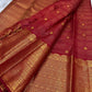 Broad classic-gold ornamental registers framing the vivid red Kanchipuram body.