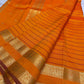 Kanchipattu silk saree in sunset orange with reddish pink border Veldhari Rettapet weave traditional zari detail