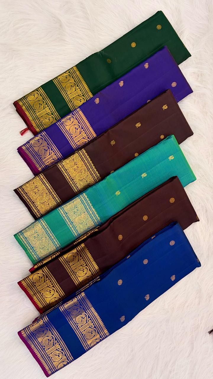 Self-colour pallu of shot colour green teal Kanjipuram pure silk saree with cascading Vanasringaram Yaanai antique gold zari