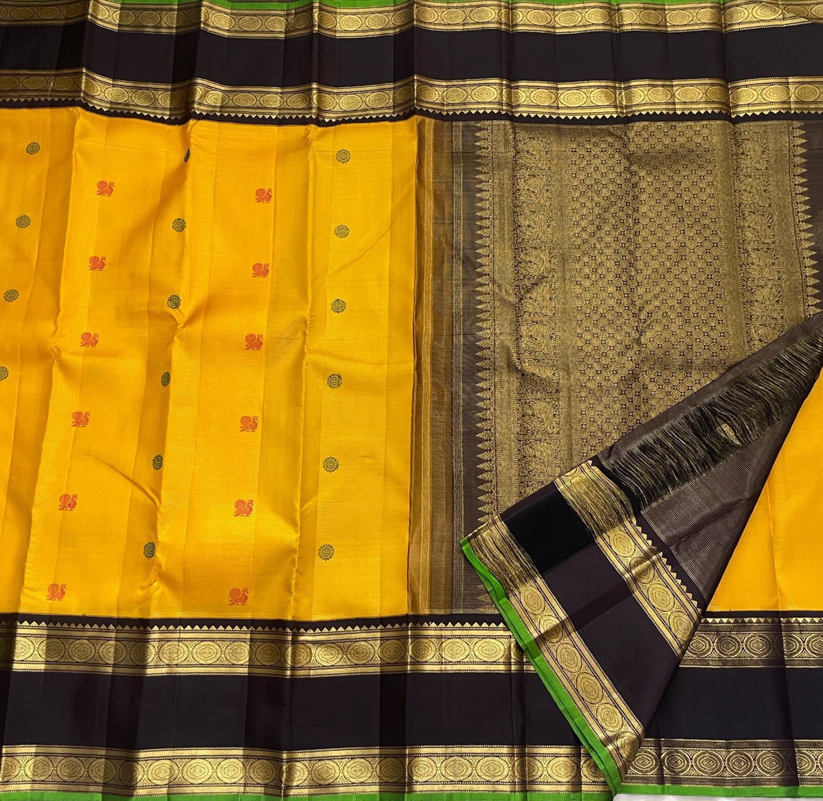 Turmeric Yellow Handwoven Pure Silk Kanchipuram Saree with Rettapet Border and Mayil Chakram, silk body close-up
