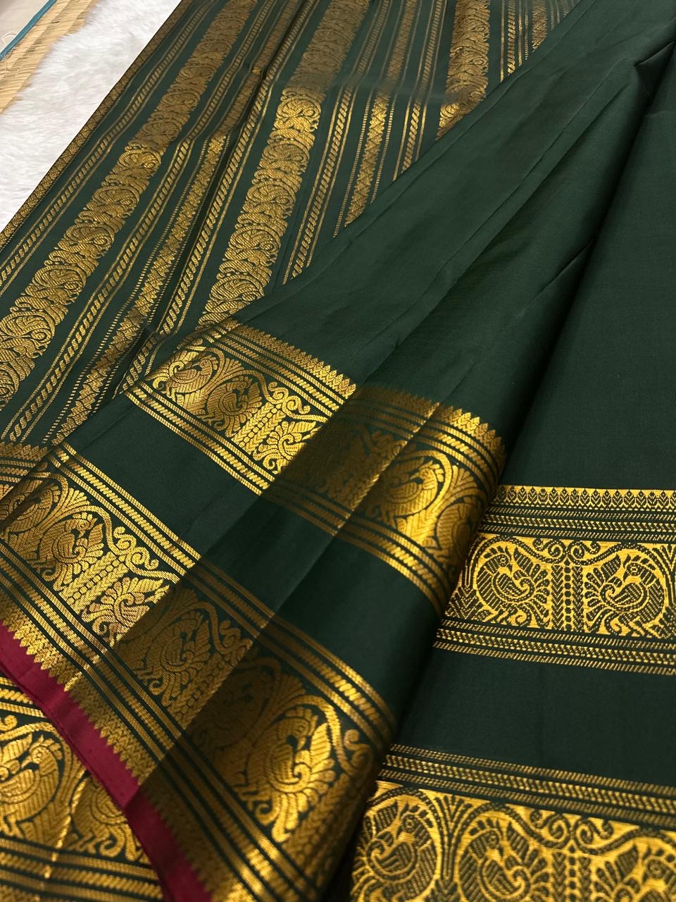 Bottle Green and Arakku Red Handwoven Pure Silk Kanjipuram Saree with Rettapet Yaanai Chakram Butta and Annam Pallu Border