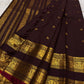 Deep wine plum handwoven pure silk Kanjipuram saree with Rettapet weave Pavun coin butta and ornate antique gold zari border overview