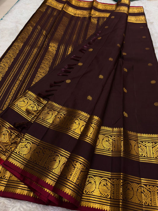 Deep wine plum handwoven pure silk Kanjipuram saree with Rettapet weave Pavun coin butta and ornate antique gold zari border overview