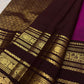 Rich antique gold zari border detail on a Vadamalli pink and Paaku brown Kanchipuram silk saree
