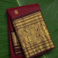 Rich burgundy red Kanchipuram silk saree with mayil motif zari border – front view