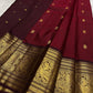 Rich burgundy red Kanjeevaram saree with deep maroon korvai border – detail view